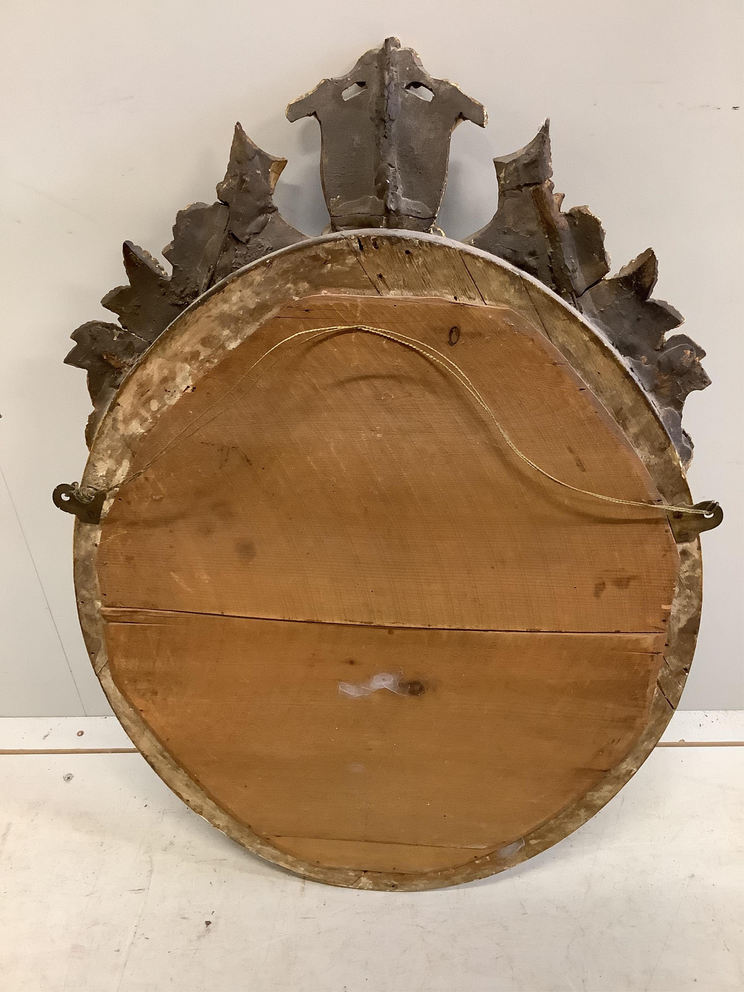 A Victorian oval giltwood and composition wall mirror, width 52cm, height 80cm. Condition - good, re-gilded